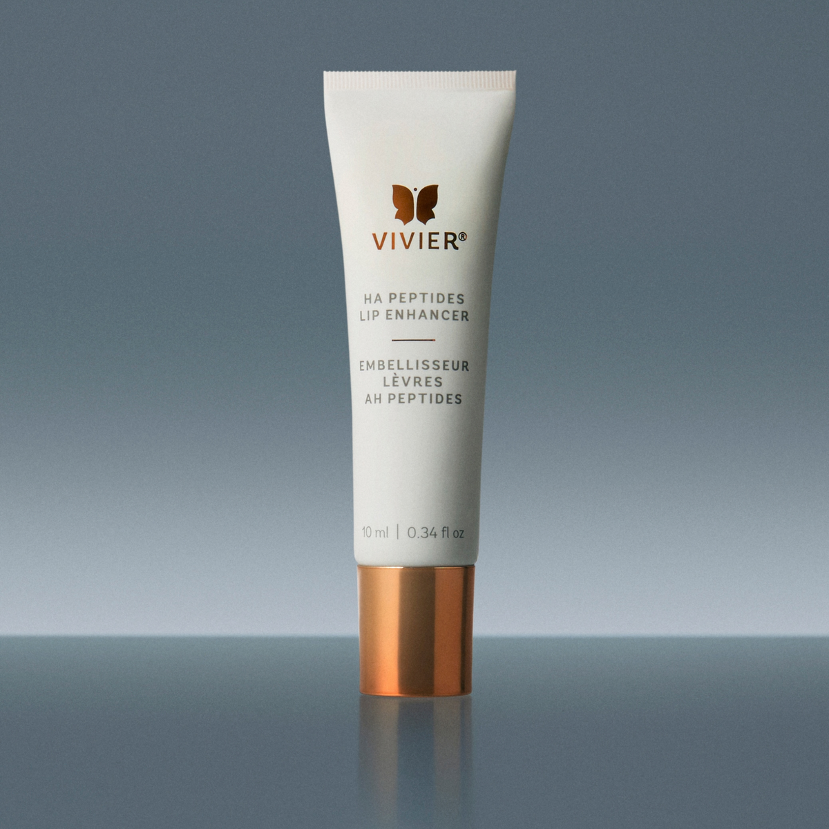 A white squeeze tube of Vivier HA Peptides Lip Enhancer with a metallic copper cap, centered against a dark gray gradient background.