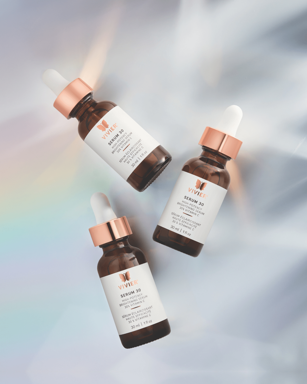 Three bottles of Vivier Serum 30 on a gradient background - Targets both surface-level and deep pigmentation and damage
