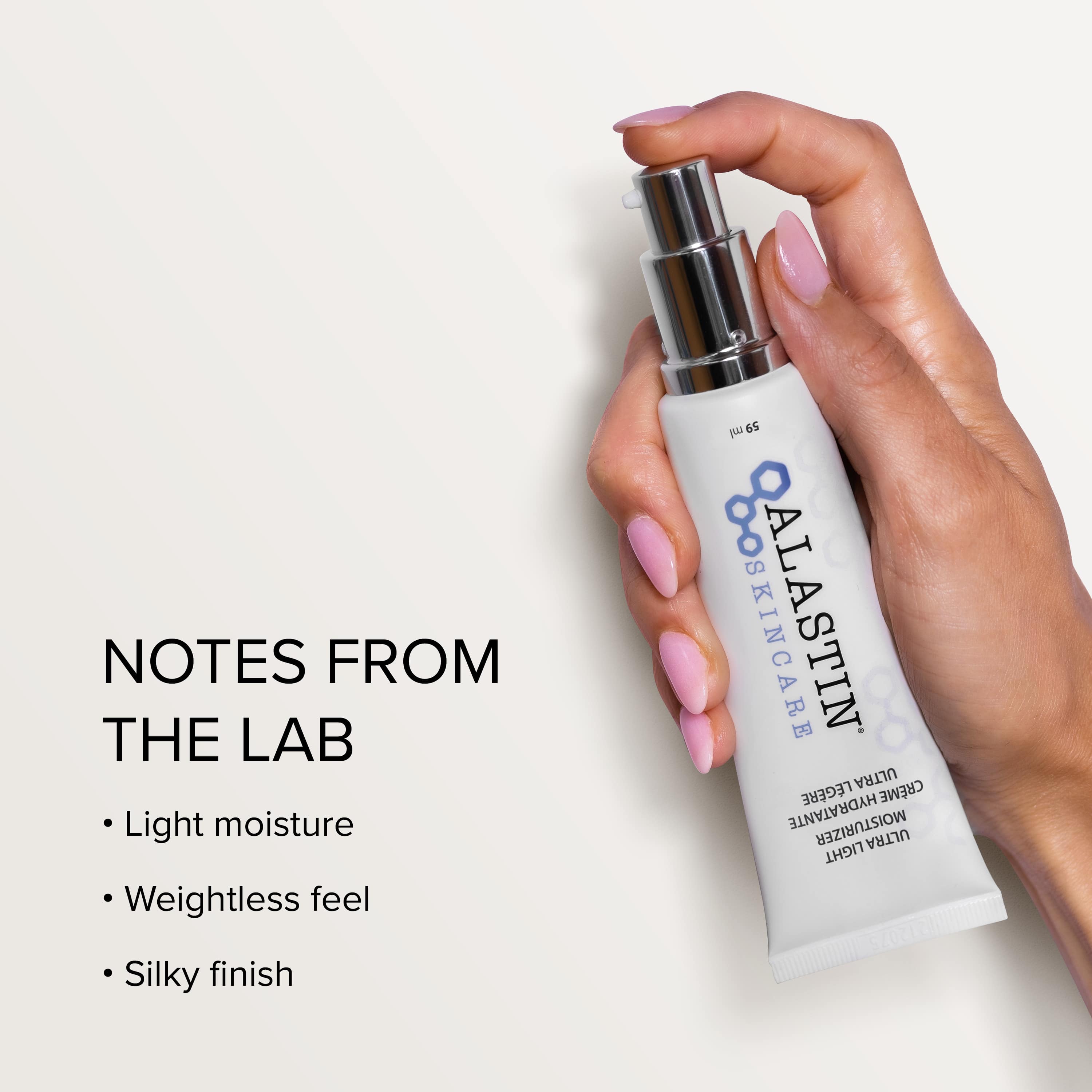 Hand holding a Alastin skincare product with text about product features on a light background, Light moisture, weightless feel, silky finish. Available in Orangeville ON