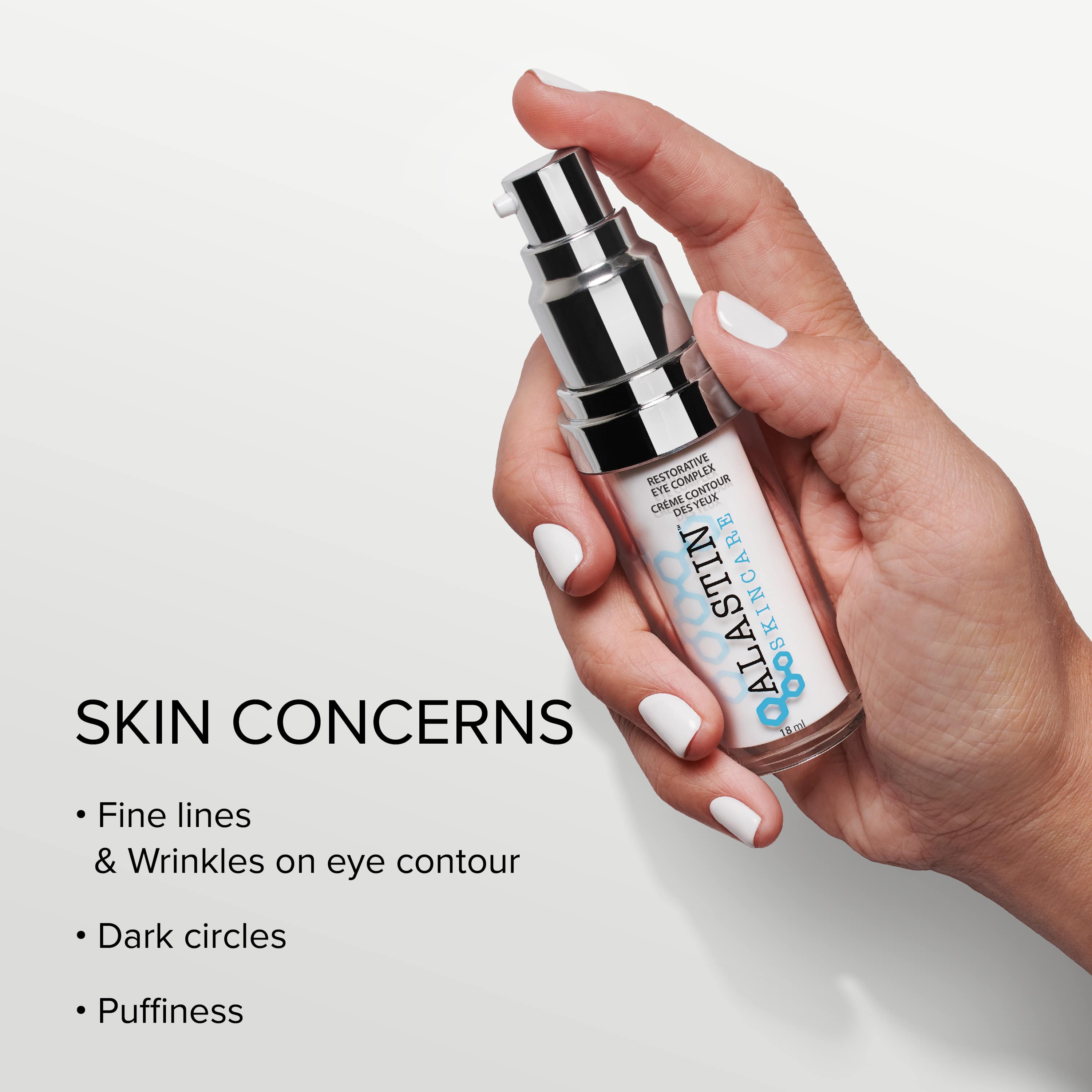 Hand holding a bottle of Restorative Eye Complex with text about skin concerns on a light background - Fine lines & Wrinkles, Dark Circles, Puffiness