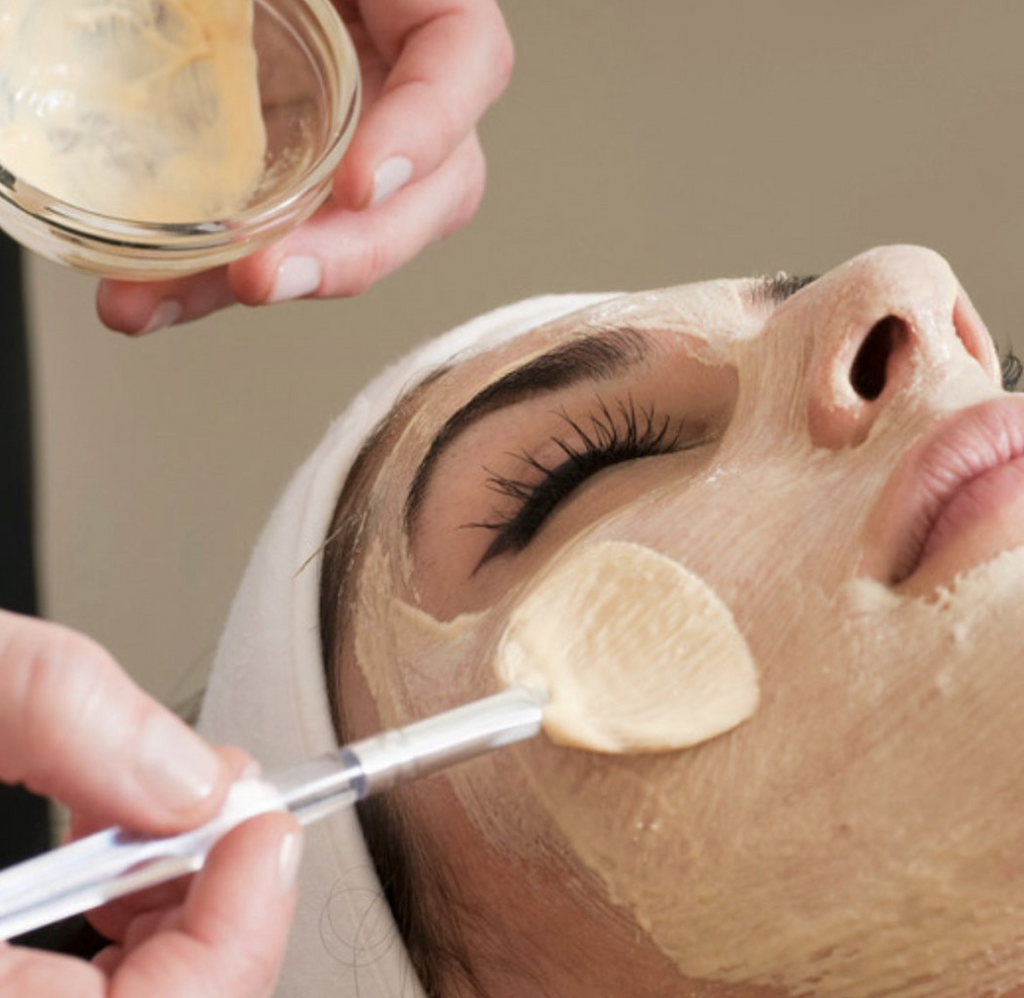 Image of a woman receiving a facial