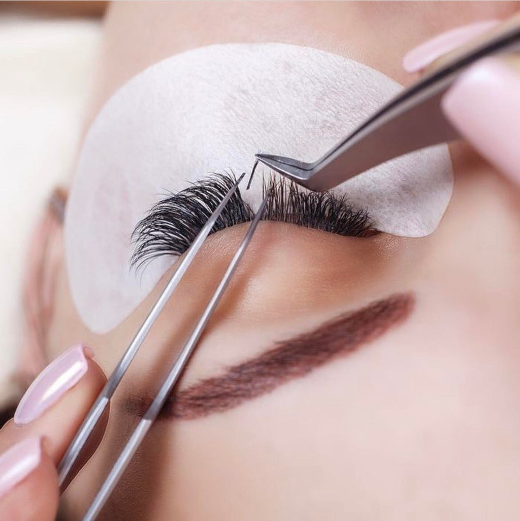 Image of a client getting lash extensions