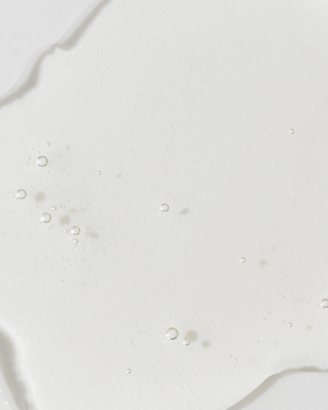 Close up of Grenzcine Serum clear serum to help visibly reduce the appearance of deeper fine lines and wrinkles 