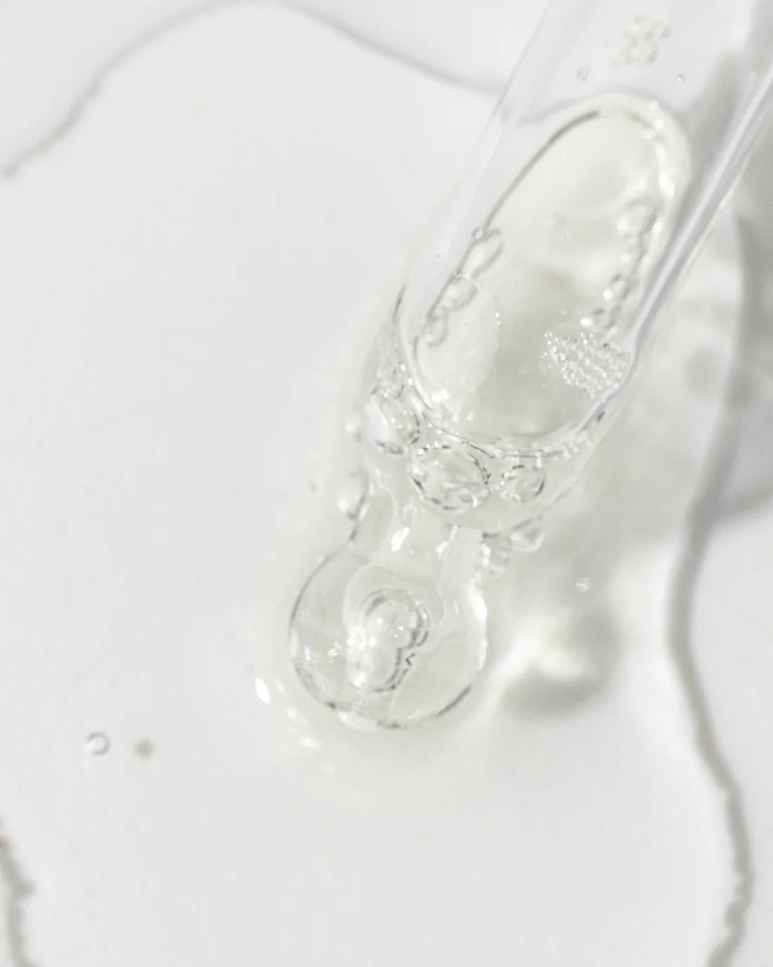 Close up of Kine-C Serum and dripper ,to address visible signs of aging and environmental damage